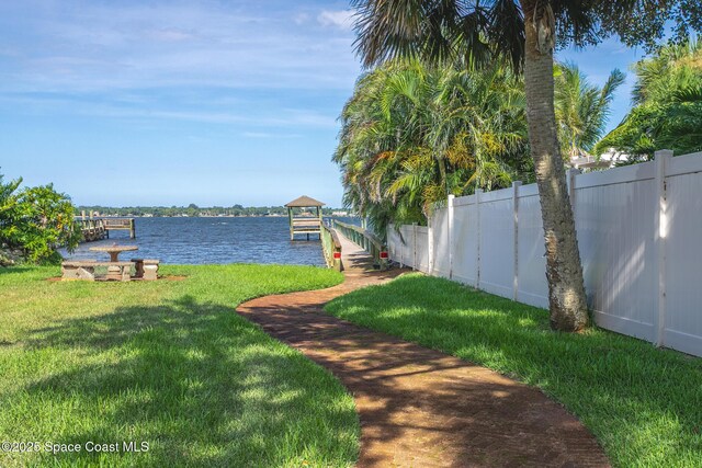 2123 Royal Oaks Dr, Rockledge, FL 32955 - view of yard with a water view and a boat dock