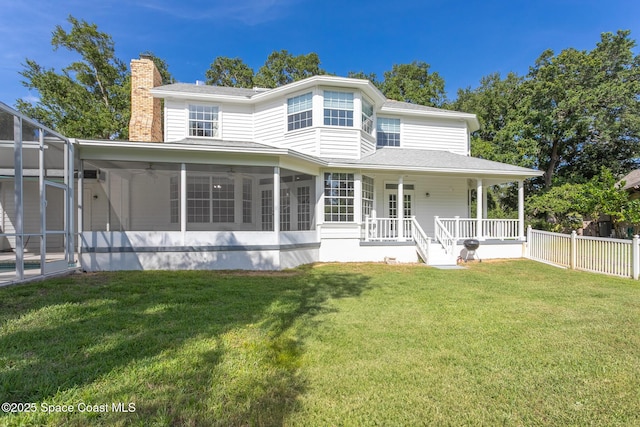 2123 Royal Oaks Dr, Rockledge, FL 32955 - back of property featuring a chimney, a ceiling fan, covered porch, a shingled roof, and a sunroom