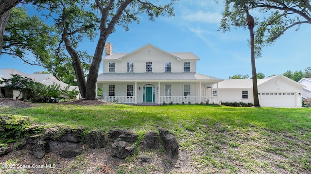 2123 Royal Oaks Dr, Rockledge, FL 32955 - country-style home with covered porch, a chimney, a front lawn, and a garage