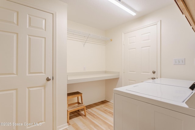 2123 Royal Oaks Dr, Rockledge, FL 32955 - laundry room with washing machine and dryer and light wood finished floors