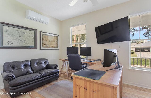 2123 Royal Oaks Dr, Rockledge, FL 32955 - home office with a wall mounted AC, light wood-type flooring, and a ceiling fan