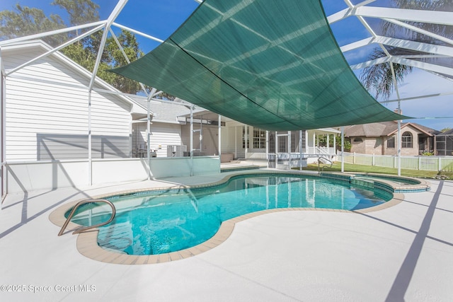 2123 Royal Oaks Dr, Rockledge, FL 32955 - view of pool with a patio, glass enclosure, and a pool with connected hot tub