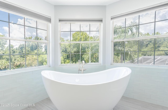2123 Royal Oaks Dr, Rockledge, FL 32955 - full bath featuring tile walls and a freestanding bath