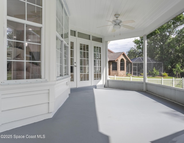 2123 Royal Oaks Dr, Rockledge, FL 32955 - unfurnished sunroom featuring a ceiling fan and french doors