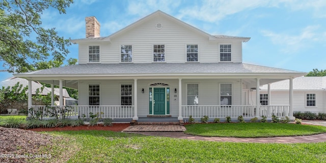 2123 Royal Oaks Dr, Rockledge, FL 32955 - country-style home with a porch, a front lawn, a shingled roof, and a chimney