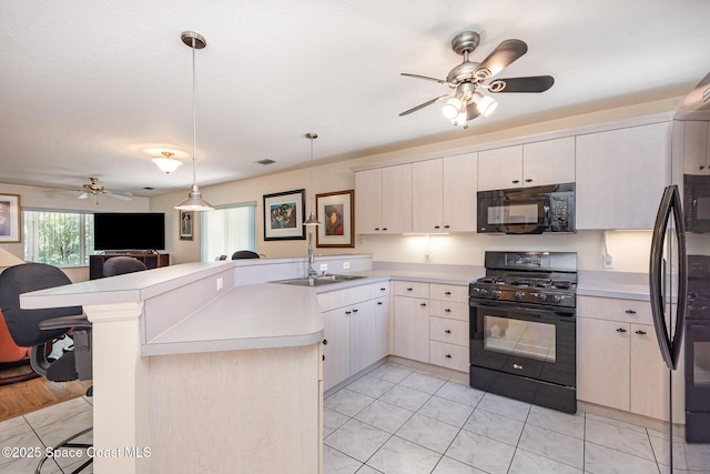 112 Plover Ln Unit 6-33, Rockledge, FL 32955 - kitchen featuring black appliances, ceiling fan, a peninsula, open floor plan, and light countertops
