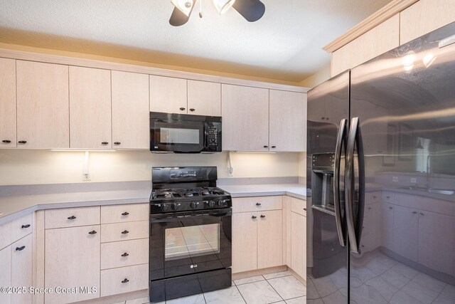 112 Plover Ln Unit 6-33, Rockledge, FL 32955 - kitchen featuring black appliances, light countertops, and a ceiling fan
