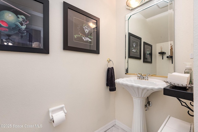 112 Plover Ln Unit 6-33, Rockledge, FL 32955 - bathroom with baseboards