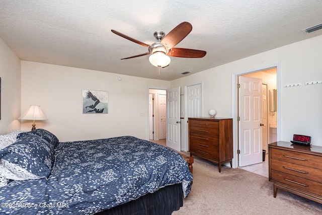 112 Plover Ln Unit 6-33, Rockledge, FL 32955 - bedroom featuring light carpet, ceiling fan, and a textured ceiling