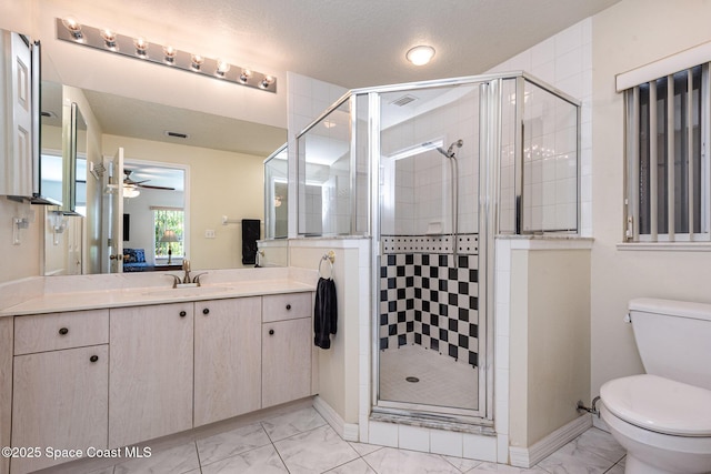 112 Plover Ln Unit 6-33, Rockledge, FL 32955 - bathroom featuring marble finish flooring, vanity, a ceiling fan, and a stall shower