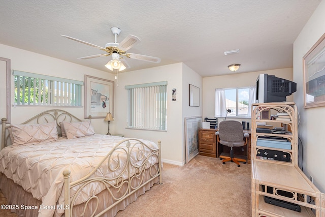 112 Plover Ln Unit 6-33, Rockledge, FL 32955 - bedroom featuring light colored carpet, a ceiling fan, and a textured ceiling