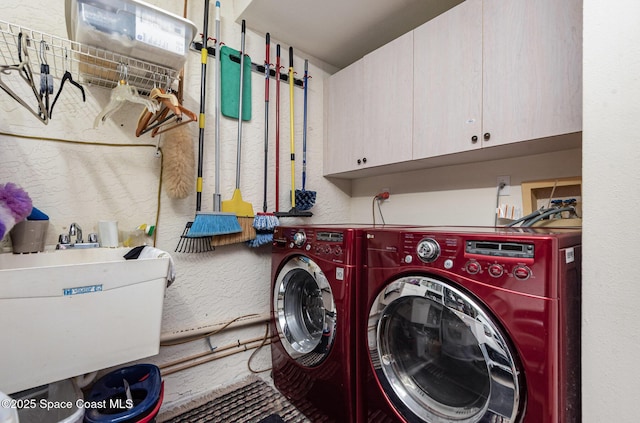 112 Plover Ln Unit 6-33, Rockledge, FL 32955 - laundry room featuring cabinet space, washing machine and dryer, and a textured wall