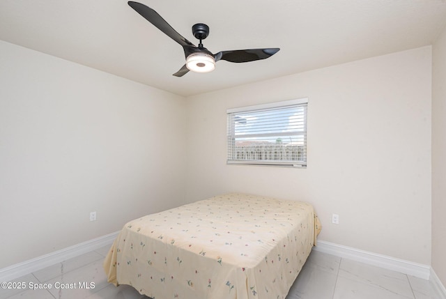 1245 Arlington Cir, Merritt Island, FL 32952 - bedroom featuring baseboards and a ceiling fan
