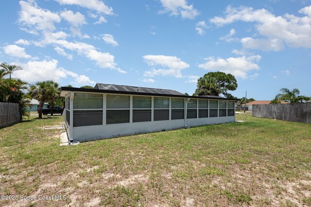 1245 Arlington Cir, Merritt Island, FL 32952 - back of property with a sunroom