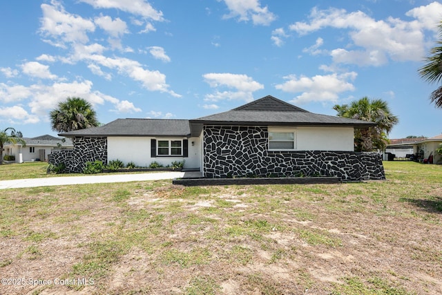 1245 Arlington Cir, Merritt Island, FL 32952 - view of front of house with stucco siding and a front yard