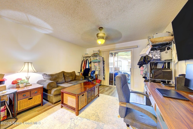 1240 Cheney Hwy Unit F, Titusville, FL 32780 - office area featuring ceiling fan, wood finished floors, and a textured ceiling