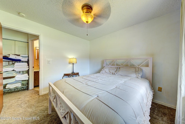 1240 Cheney Hwy Unit F, Titusville, FL 32780 - bedroom with carpet flooring, a textured ceiling, and ceiling fan