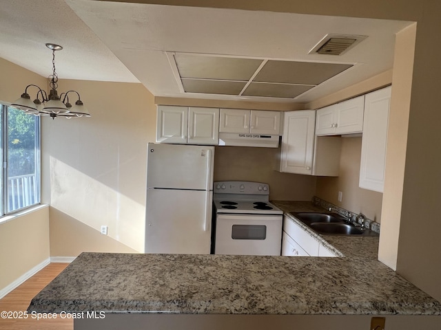 800 N Fiske Blvd Unit 613, Cocoa, FL 32922 - kitchen featuring white appliances, under cabinet range hood, light wood-style floors, a chandelier, and white cabinetry