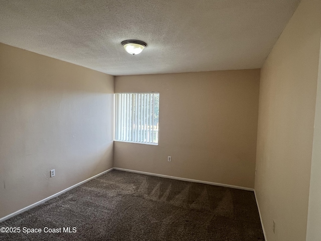 800 N Fiske Blvd Unit 613, Cocoa, FL 32922 - spare room with dark colored carpet and a textured ceiling