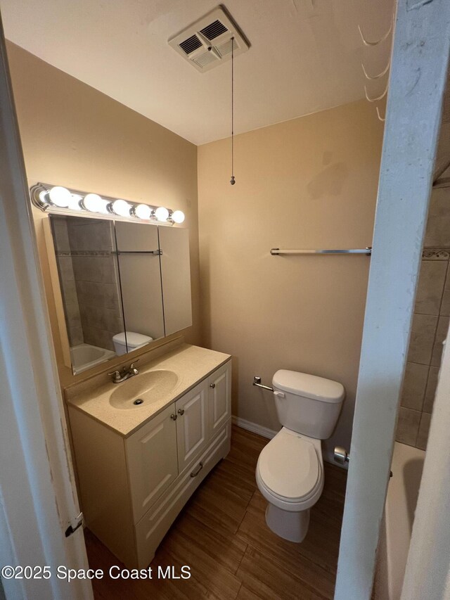 800 N Fiske Blvd Unit 613, Cocoa, FL 32922 - full bathroom featuring vanity, wood finished floors, and a tub