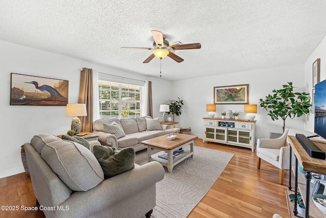 3127 Marshall Dr, Melbourne, FL 32901 - living room with ceiling fan, wood finished floors, and a textured ceiling