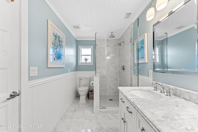 3127 Marshall Dr, Melbourne, FL 32901 - bathroom featuring a stall shower, crown molding, vanity, a wainscoted wall, and marble finish floors