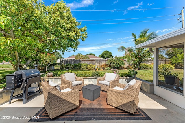 3127 Marshall Dr, Melbourne, FL 32901 - fenced backyard featuring area for grilling, an outdoor hangout area, and a patio area