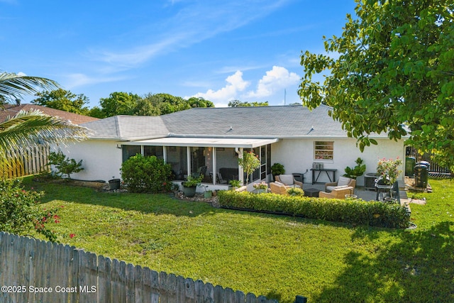 3127 Marshall Dr, Melbourne, FL 32901 - back of house featuring a sunroom, stucco siding, and outdoor lounge area