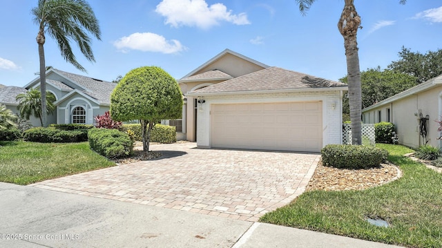 7927 Citrus Creek Dr, Melbourne, FL 32940 - view of front of house featuring driveway, a garage, a front yard, and brick siding