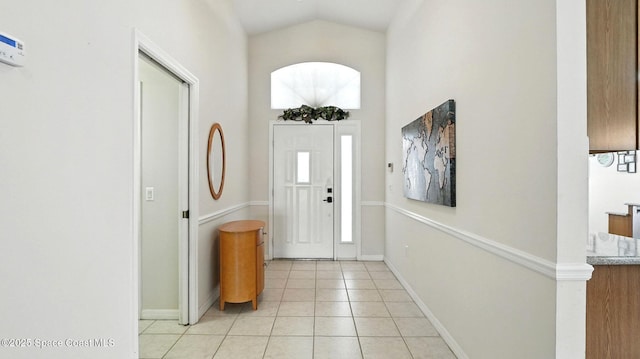 7927 Citrus Creek Dr, Melbourne, FL 32940 - entryway with light tile patterned floors and high vaulted ceiling