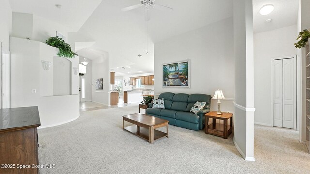 7927 Citrus Creek Dr, Melbourne, FL 32940 - living area with light carpet, high vaulted ceiling, and ceiling fan