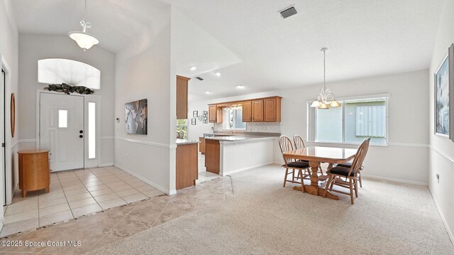 7927 Citrus Creek Dr, Melbourne, FL 32940 - entryway featuring a chandelier, light tile patterned floors, recessed lighting, and high vaulted ceiling