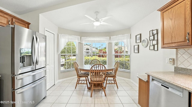 7927 Citrus Creek Dr, Melbourne, FL 32940 - dining area with ceiling fan and light tile patterned flooring