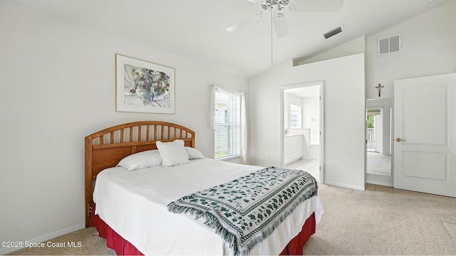 7927 Citrus Creek Dr, Melbourne, FL 32940 - bedroom with vaulted ceiling, light carpet, multiple windows, connected bathroom, and ceiling fan
