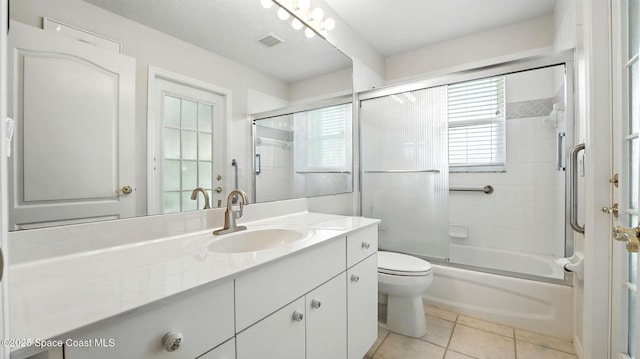 7927 Citrus Creek Dr, Melbourne, FL 32940 - bathroom featuring vanity, enclosed tub / shower combo, and tile patterned floors