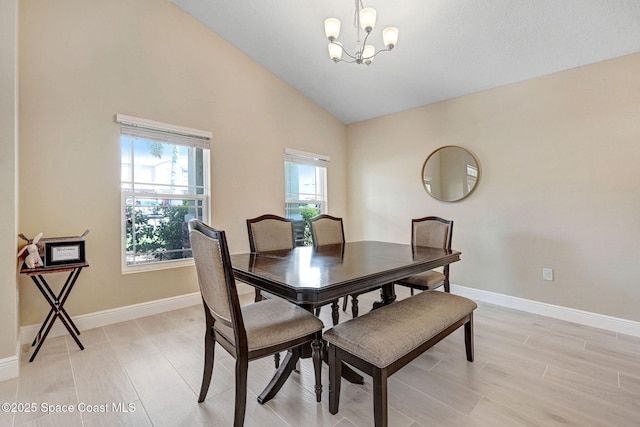 2248 Attilburgh Blvd, West Melbourne, FL 32904 - dining space with a chandelier, high vaulted ceiling, and light wood-style flooring