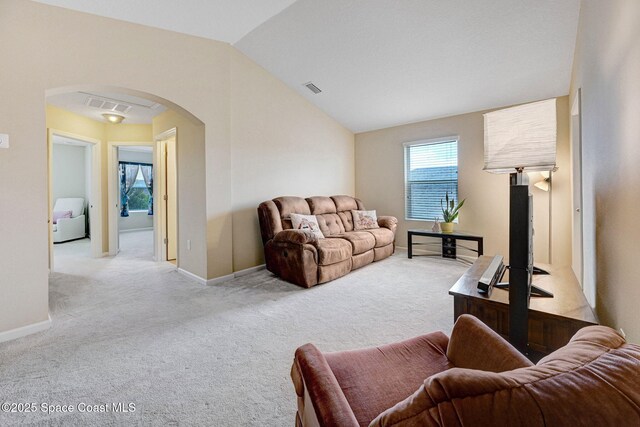2248 Attilburgh Blvd, West Melbourne, FL 32904 - living room featuring arched walkways, carpet, healthy amount of natural light, and lofted ceiling