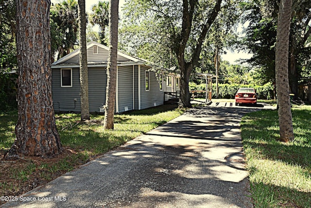 2508 Palmetto Dr, Cocoa, FL 32926 - view of home's exterior featuring asphalt driveway