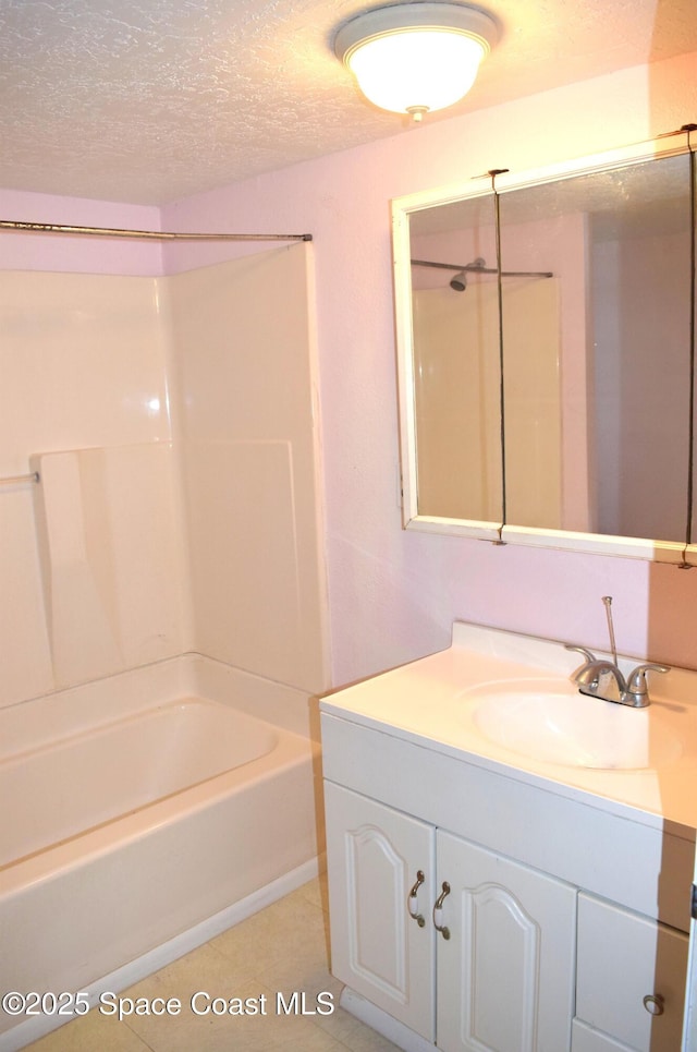 2508 Palmetto Dr, Cocoa, FL 32926 - full bathroom with vanity, a textured ceiling, shower / tub combination, and tile patterned flooring