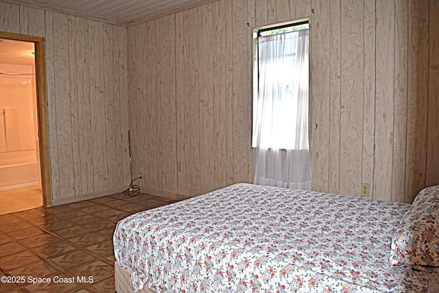 2508 Palmetto Dr, Cocoa, FL 32926 - bedroom featuring wooden walls and baseboards