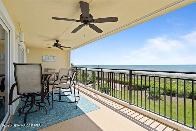 2375 S Atlantic Ave Unit 302, Cocoa Beach, FL 32931 - balcony with ceiling fan and view of water and beach