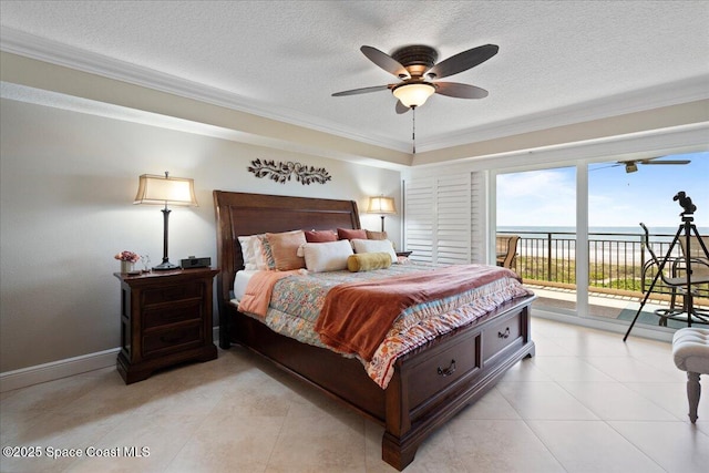 2375 S Atlantic Ave Unit 302, Cocoa Beach, FL 32931 - bedroom featuring access to outside, a textured ceiling, ornamental molding, a water view, and light tile patterned floors