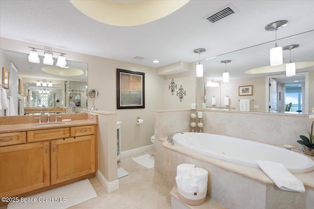 2375 S Atlantic Ave Unit 302, Cocoa Beach, FL 32931 - bathroom with a garden tub, vanity, and tile patterned floors