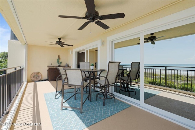 2375 S Atlantic Ave Unit 302, Cocoa Beach, FL 32931 - patio / terrace featuring ceiling fan and a water view