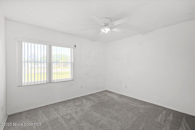 1638 Riviera Dr NE, Palm Bay, FL 32905 - carpeted spare room featuring ceiling fan and baseboards