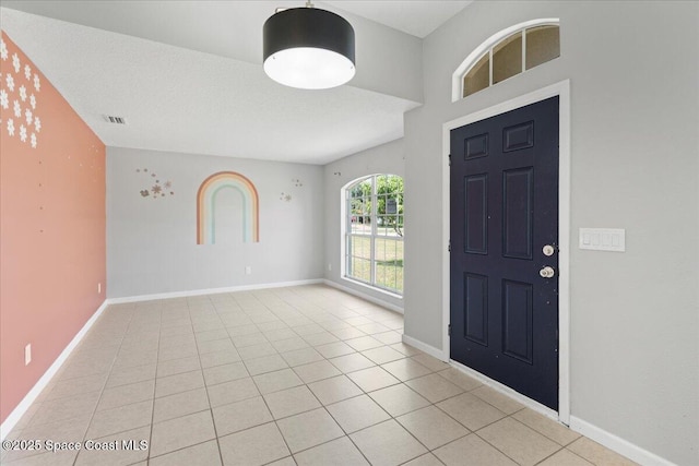 781 Dinner St NE, Palm Bay, FL 32907 - foyer with light tile patterned floors and baseboards