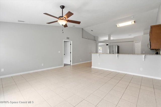 781 Dinner St NE, Palm Bay, FL 32907 - unfurnished living room featuring a ceiling fan and high vaulted ceiling