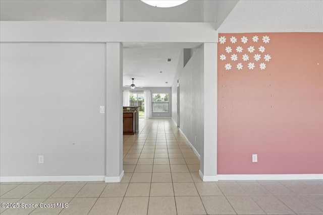 781 Dinner St NE, Palm Bay, FL 32907 - corridor featuring baseboards and light tile patterned flooring