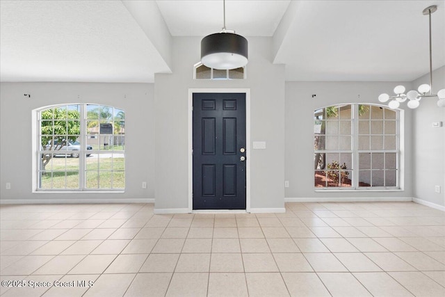 781 Dinner St NE, Palm Bay, FL 32907 - foyer with baseboards and light tile patterned floors