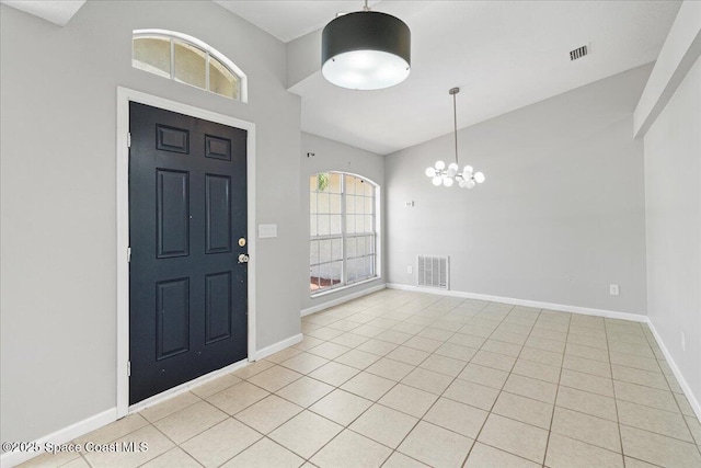 781 Dinner St NE, Palm Bay, FL 32907 - entrance foyer featuring a chandelier, high vaulted ceiling, and light tile patterned floors